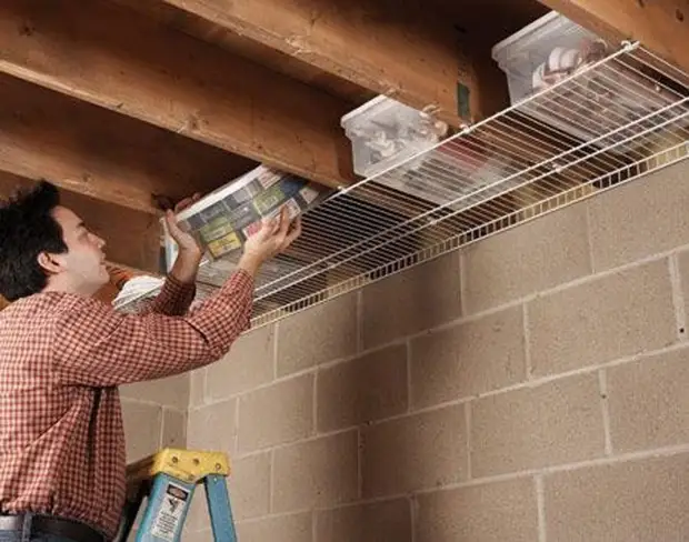 Shelves under ceiling beams.