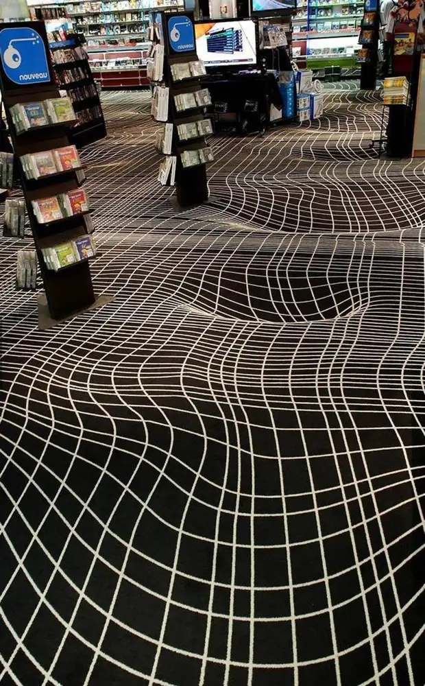 Another illusion: the floor is absolutely smooth, but the drawing creates the impression of the holes. Interior design, floors