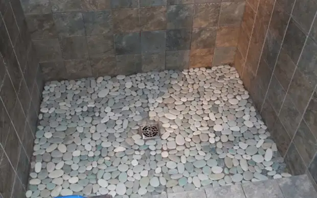 The floor of pebbles will best look in the bathroom or shower. Interior design, floors