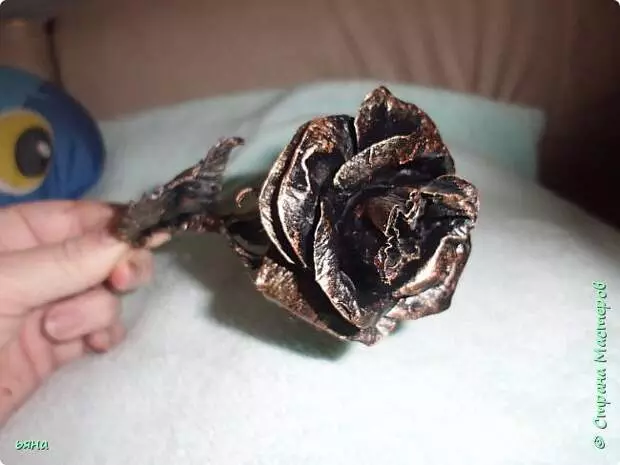 Create a "wrought-iron" rose from toilet paper