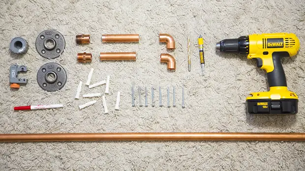 Hanging Copper Pipe Clothing Rack DIY (click through for tutorial)