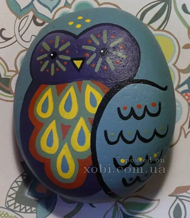 owls drawn on stones