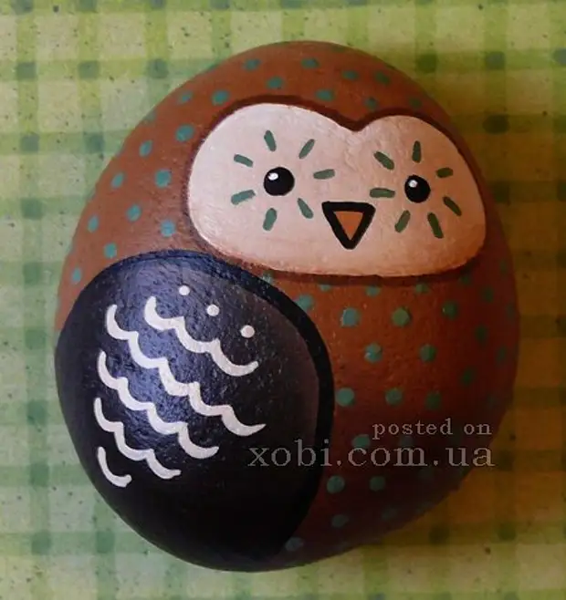 owls drawn on stones