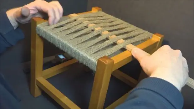 Braided chair with her hands